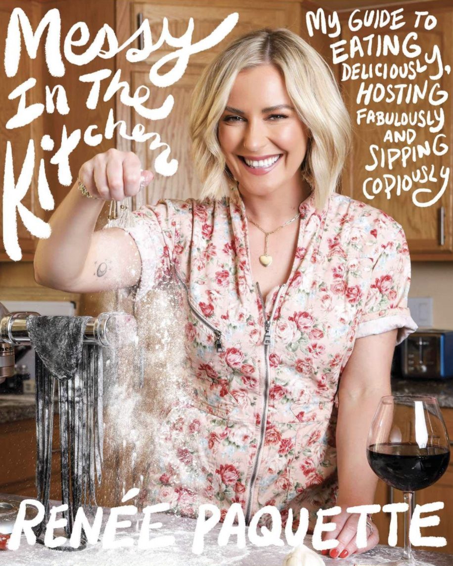 Messy in the Kitchen cookbook cover: Renée Paquette laughing and dusting flour over fresh pasta in a floral dress