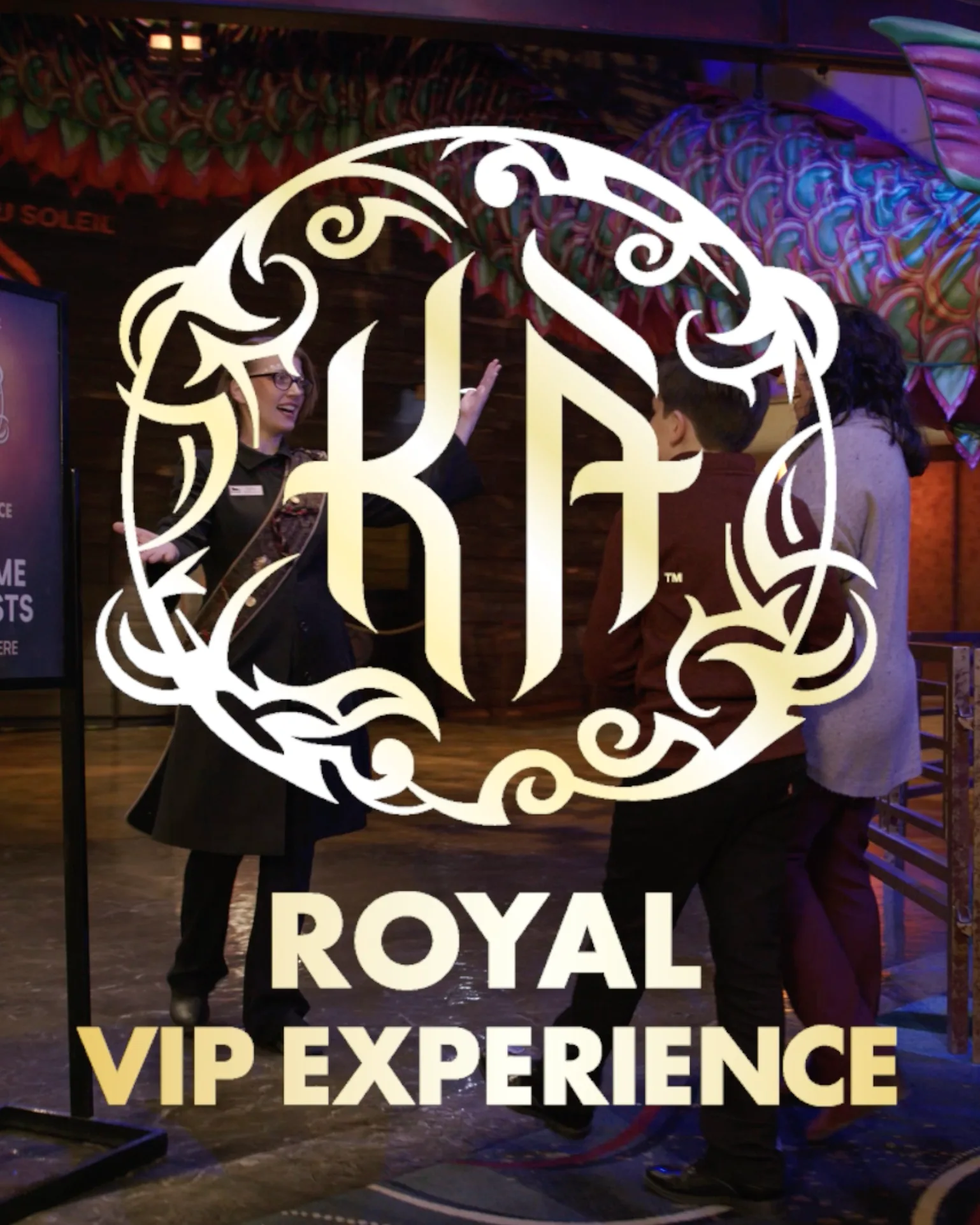 KA Royal VIP Experience video still with the gold KA logo over a host greeting guests at the theater entrance
